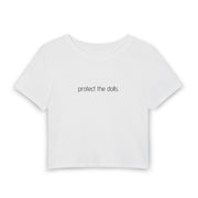 A white short-sleeve crop top t-shirt with the phrase 'protect the dolls' printed in a black lowercase serif font across the chest, displayed on a clean white background.