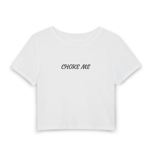 A white short-sleeve crop top t-shirt with the words 'CHOKE ME' printed in black script across the chest, displayed on a clean white background.