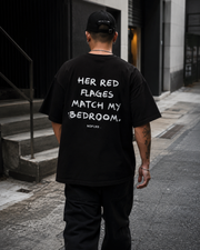 HER RED FLAGS MATCH MY BEDROOM.